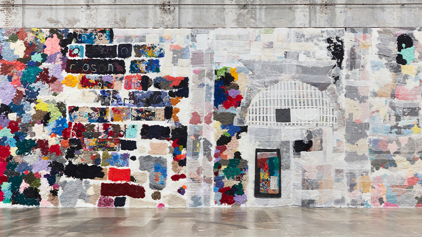 Elizabeth Day's woven wall patchwork installation hangs on a wall within Carriageworks