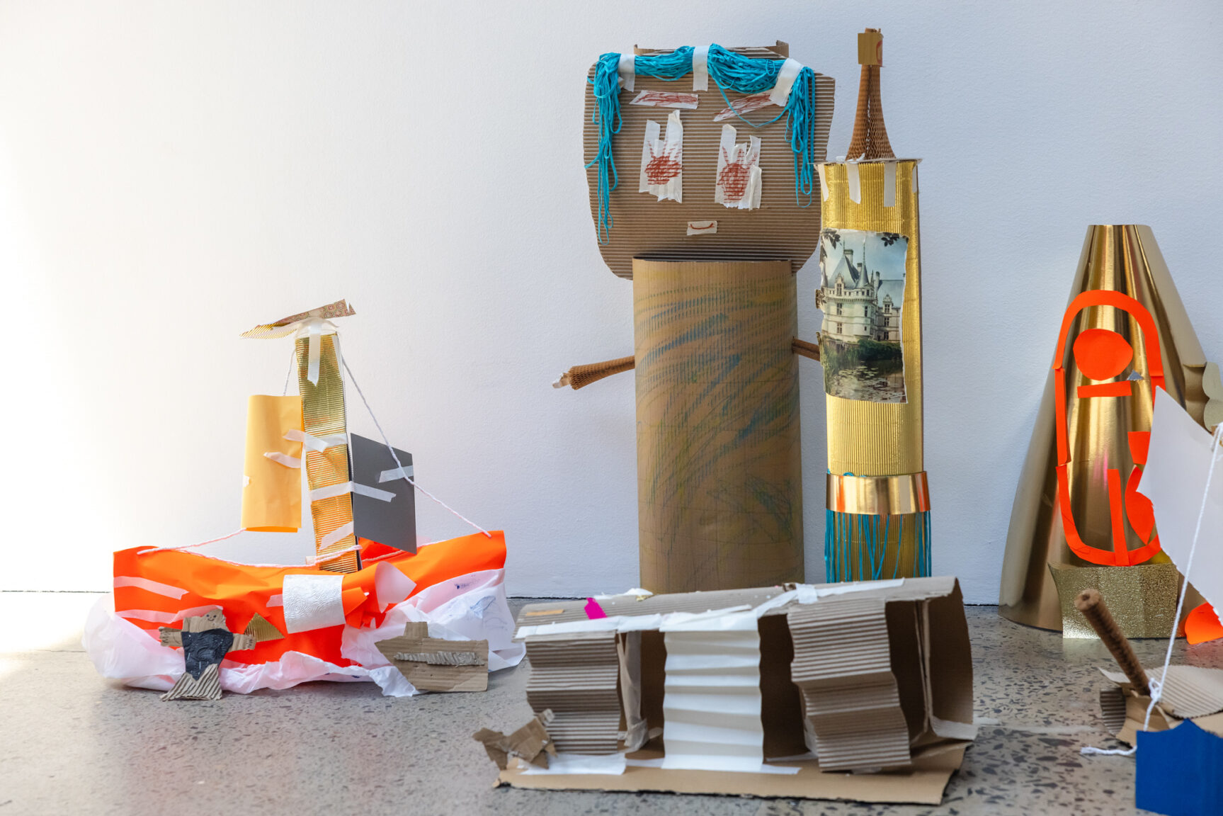 a group of cardboard creations inspired by Salote Tawale's exhibition