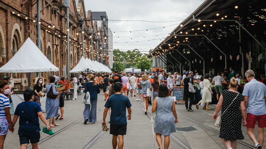 Guests wander through Carriageworks Christmas Twilight Market