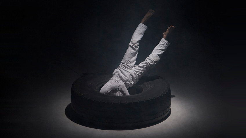 Raghav Handa is face-first in a large tyre.