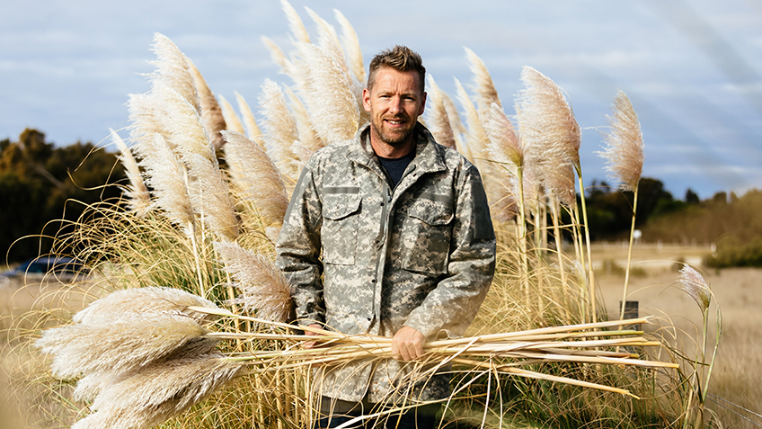 Joost Bakker in a field of wheat