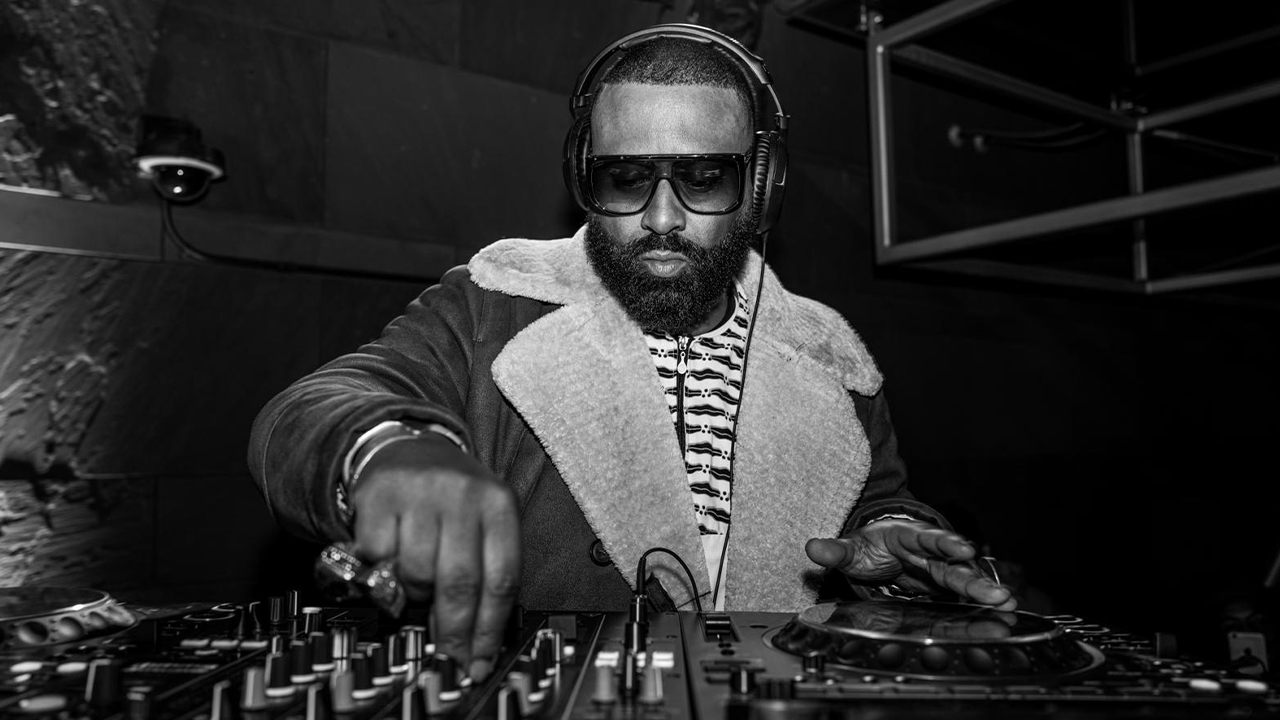 A black and white image of Madlib DJing