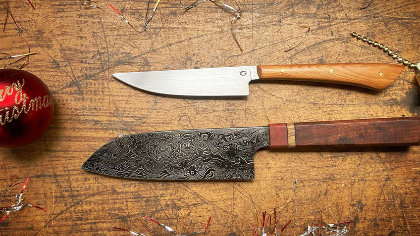 Two Tharwa knives sit on a wooden bench